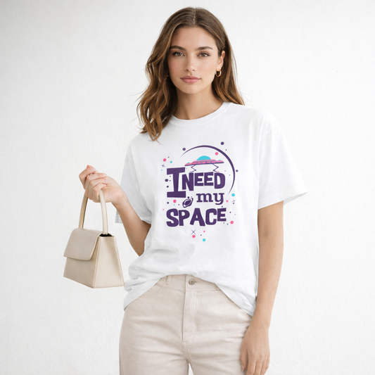 Woman wearing a white t-shirt with 'I Need My Space' text design on a plain background