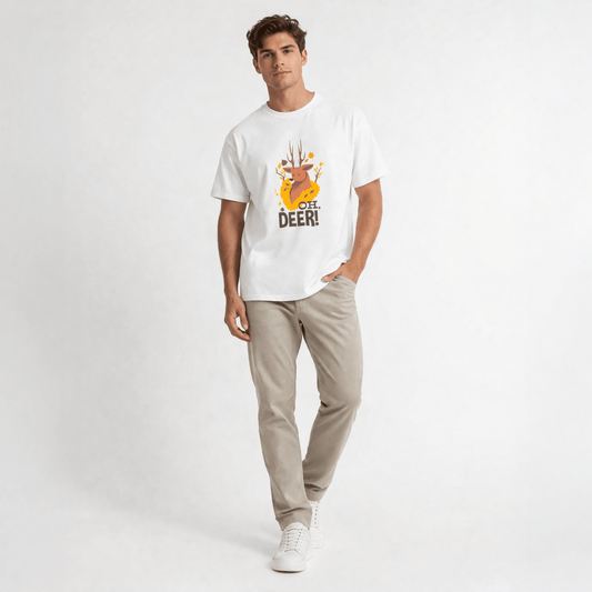 Man wearing a white t-shirt with a graphic design and text, standing against a plain background